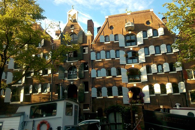 1,5 hours Amsterdam Rickshaw Tour - Visiting Nieuwmarkt and the Waag