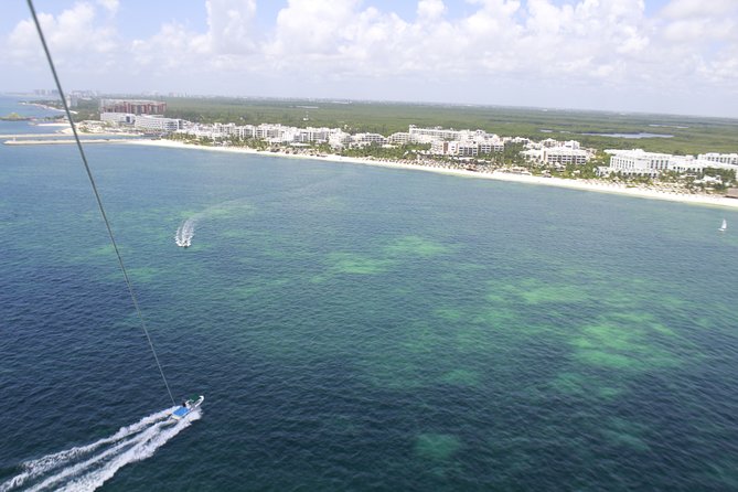 2 in 1 Parasailing and Speedboat Tour in Cancun - Parasailing Over Cancuns Turquoise Waters