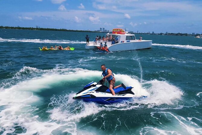 3 Hour Party Boat Jet ski Banana Tube and open bar in Miami - Exciting Water Adventure in Miami: Jet Skis, Banana Boat, and Open Bar Included