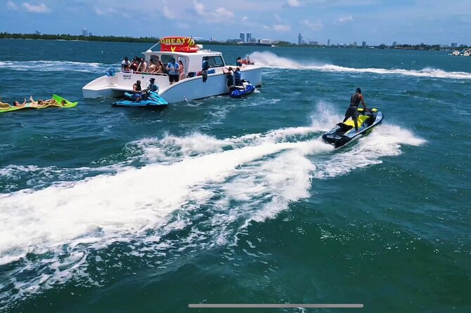 3 Hour Party Boat Jet ski Banana Tube and open bar in Miami - Banana Boat & Towable Tube: Guaranteed Fun on the Water