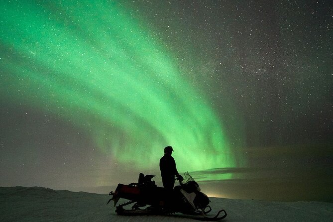 3 Hours Snowmobiling under Auroras and Night Sky - Warmth, Food, and Drink by the Campfire