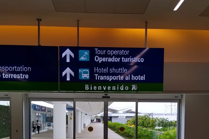 Airport Transfers to Puerto Aventuras - Private van (ROUND TRIP) FLAT RATE - How the Driver Meets You at Cancun Airport