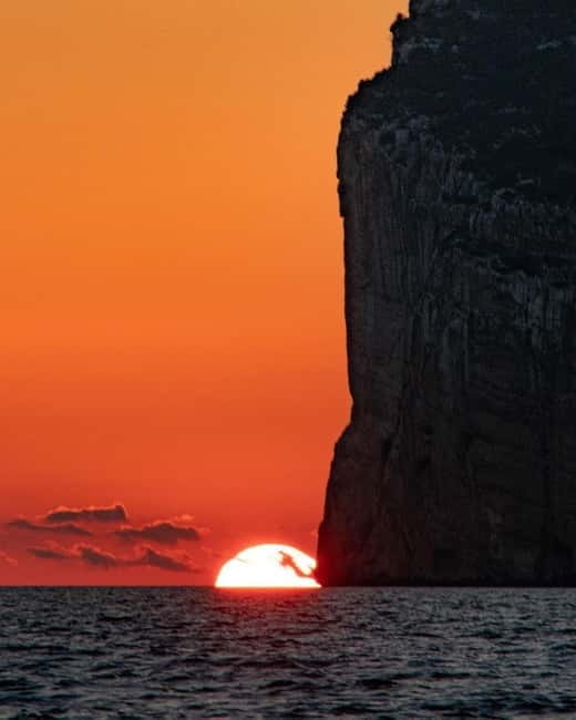 Alghero: boat tour with aperitif at sunset Porto Conte - Enjoying Local Wine and Light Snacks at Sunset