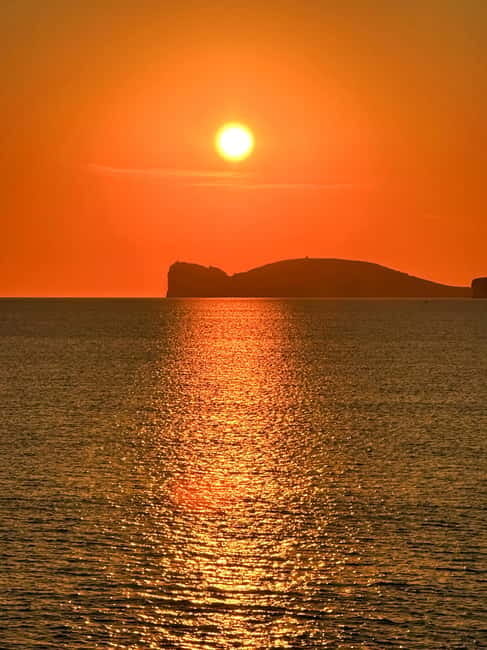 Alghero: boat tour with aperitif at sunset Porto Conte - Captivating Sunset Views Over Capo Caccia