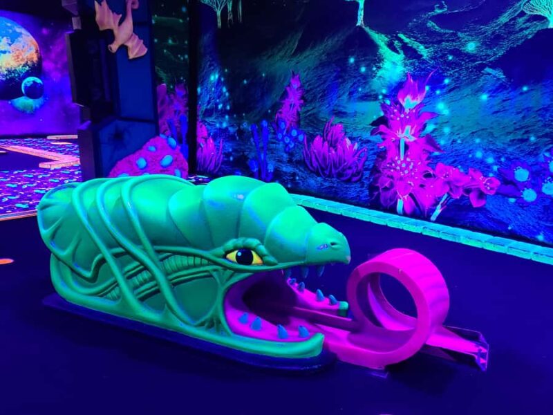 American Dream: Blacklight Mini Golf Entry Ticket - Family-Friendly Fun and Social Media Appeal