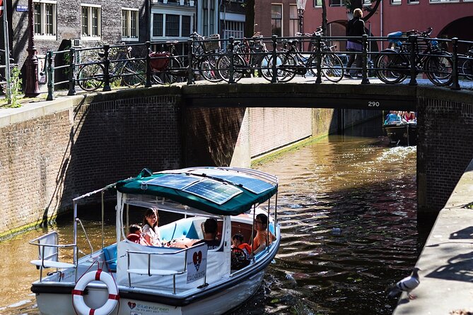 Amsterdam 90-min Private Canal Cruise with Live Guide and Drinks - Practical Details: Booking, Weather, and Accessibility