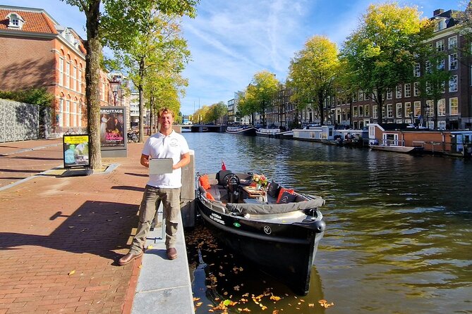 Amsterdam Canal Cruise on a small open boat (max 12 guests) - Small-Boat Canal Tour in Amsterdam: A Personalized Waterway Experience