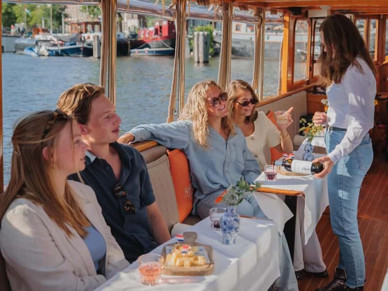 Amsterdam: Classic Saloon Boat Cruise with Cheese & Wine - Discover Amsterdam’s Canals on a Classic Saloon Boat with Cheese & Wine