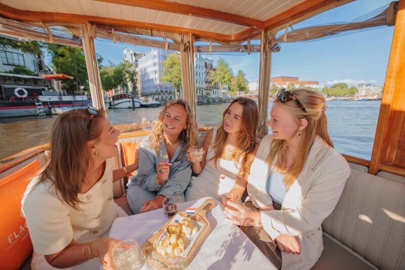 Amsterdam: Classic Saloon Boat Cruise with Cheese & Wine - Enjoying Drinks and Food Onboard
