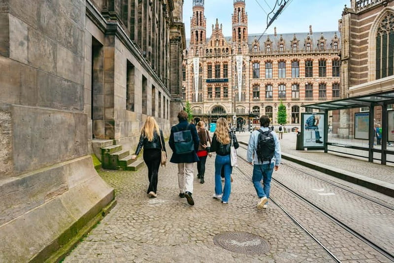 Amsterdam: Cultural Highlights Walking Tour in EN/DE/IT - Walking Past the Beurs van Berlage and Magna Plaza