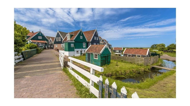 Amsterdam Day Tour: Zaanse Schans, Volendam & Marken - Visiting the Colorful Harbor of Volendam