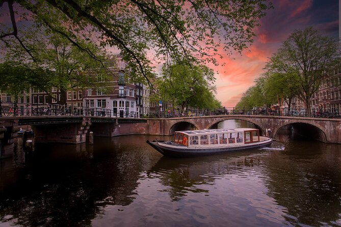 Amsterdam Evening Canal Cruise with Live Guide and Onboard Bar - Key Points