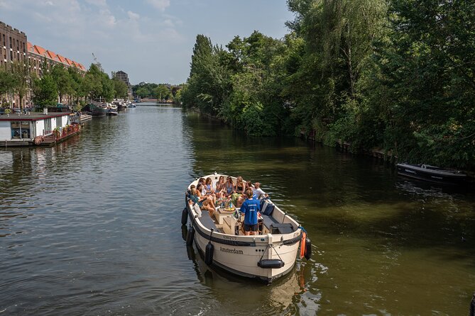 Amsterdam: Evening City Centre Canal Cruise with Unlimited Drinks - Starting Point and Logistics: Meeting at Oudezijds Voorburgwal 230
