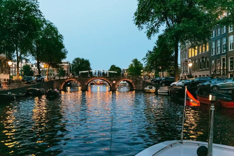 Amsterdam: Evening Cruise with Optional Wine and Snacks - The Guide and Commentary