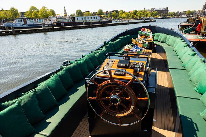 Amsterdam: Guided Open Boat Canal Cruise Including 1 Drink - Key Points