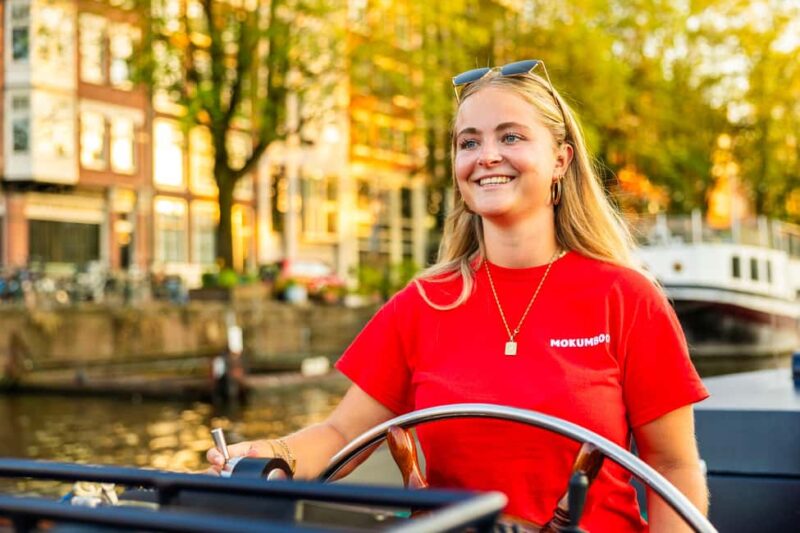 Amsterdam: Guided Open Boat Cruise Unlimited Drinks Option - Practical Details: Meeting Point, Booking, and Accessibility