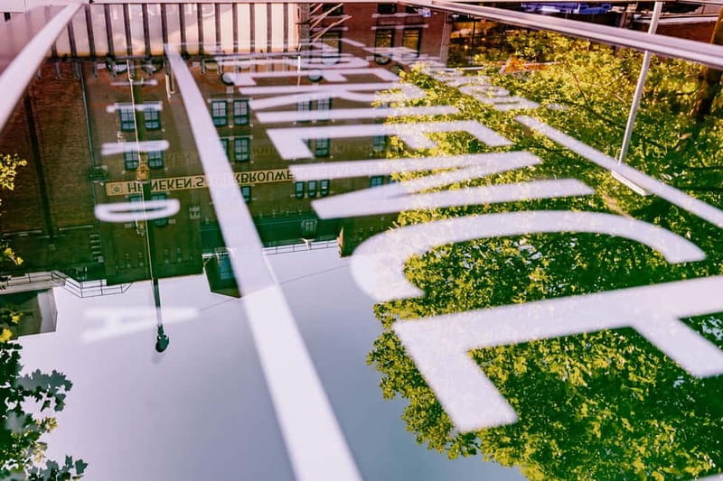 Amsterdam: Heineken Branded Canal Cruise inc 1 drink &Snacks - Scenic Views of Amsterdam’s Iconic Landmarks