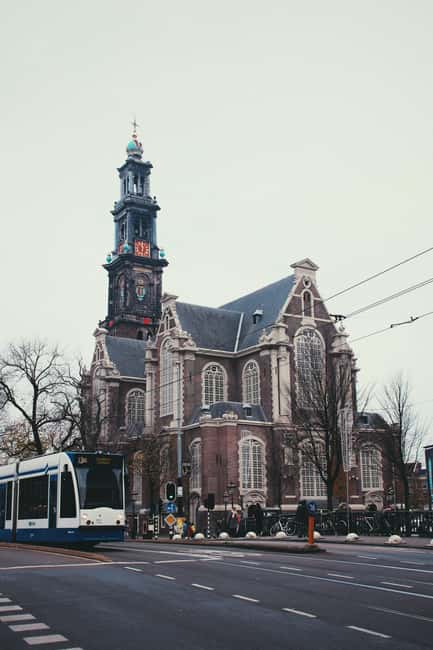 Amsterdam: Hidden Gems and Highlights in DE/EN/IT - Scenic Views and Picturesque Canals