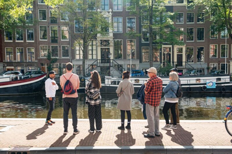 Amsterdam: Highlights & History Walking Tour - Exploring Amsterdam’s Famous Canals and Flower Market