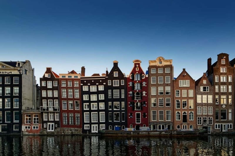 Amsterdam: Iconic Canals & Historic Sights Walking Tour - Scenic Stroll Along Canals and Bridges