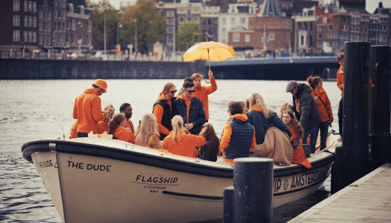 Amsterdam: King's Day Party Cruise with Open Bar & Music - Meeting Point and Accessibility