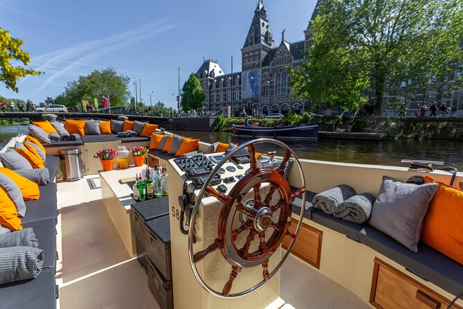 Amsterdam Light Festival: All-In Canal Cruise Covered Saloon Boat - Key Points