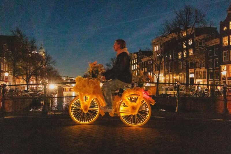 Amsterdam: Light Festival Bike Tour with Guide - The Experience of Pedaling Through Amsterdam’s Nighttime Charm