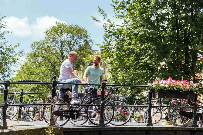 Amsterdam PRIVATE Bike Tour With Locals: Bike & Local Snack Included - Discover Amsterdam’s Neighborhoods and Landmarks by Bike
