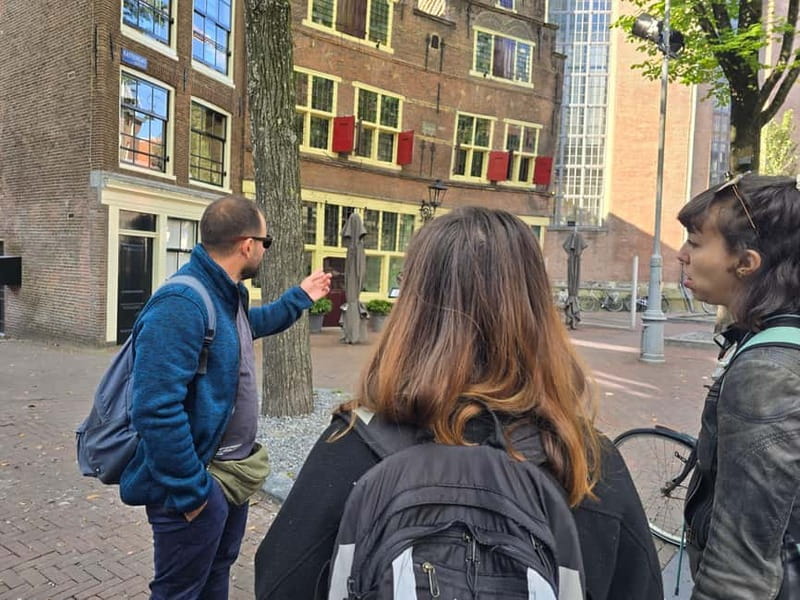 Amsterdam: Private walking tour with Coffee & Anne Frank VR - Exploring the Red Light District’s Quiet Corners and Hidden Prisons