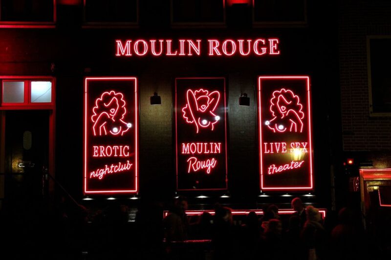 Amsterdam: Red Light District Tour in English or German - Exploring the Famous Red-Lit Windows and Neon Signs