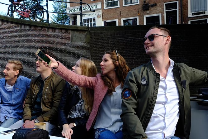 Amsterdam Small-Group Canal Cruise Including Snacks and Drinks - Highlights of the Cruise Route: From Jordaan to the Red Light District