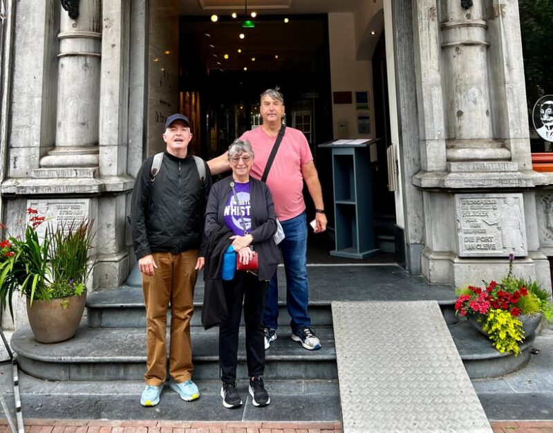 Amsterdam: Small Group Walking Tour with Fun Guide - Practical Details: Meeting Point, Weather, and Accessibility