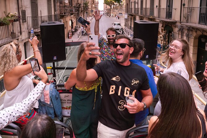 Aperitif on a bus tour around the city of Palermo - Enjoying Drinks and Snacks in a Celebratory Atmosphere