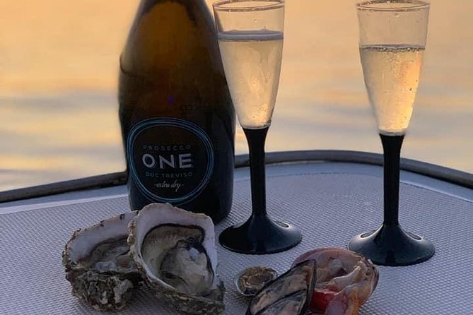 Aperitif on the boat at Sunset island and sea caves - Timing and Evening Views