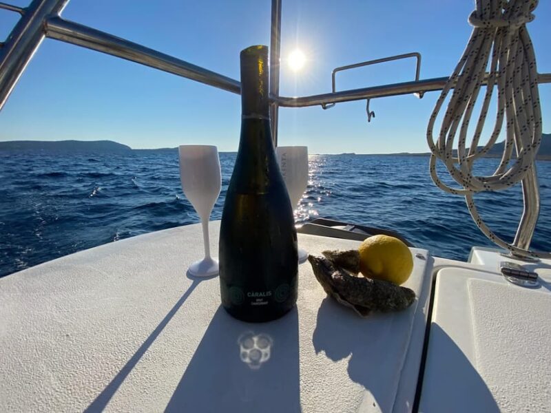 aperitifs at sunset on the Stintino catamaran burianaCharter - Departing from Stintino: A Perfect Starting Point for Sardinian Adventures