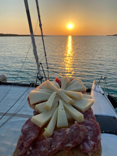 aperitifs at sunset on the Stintino catamaran burianaCharter - Who Will Enjoy This Sunset Catamaran Tour?