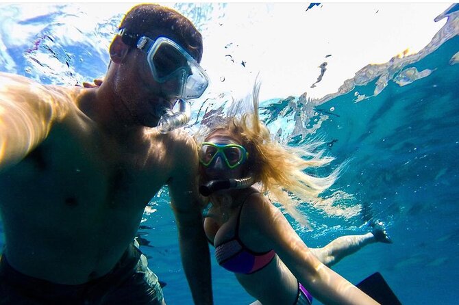 Arch Boat Tour and Snorkeling at Pelican Rock - Key Points