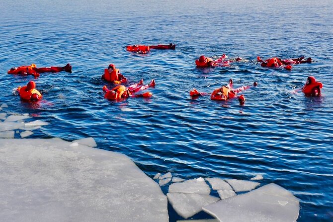 Arctic Ice floating in Puumala - The Waterproof Suit: Your Warmth in the Ice