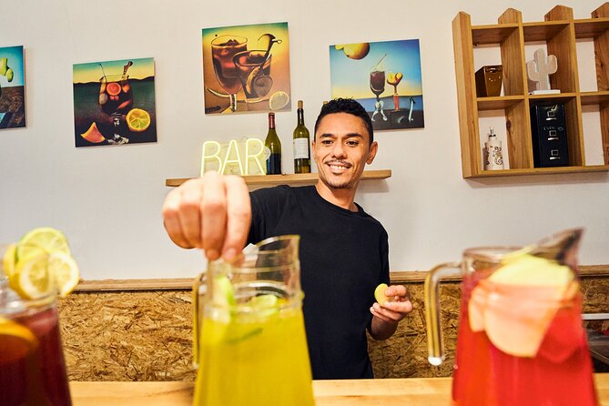 Authentic Barcelona Cooking Class: Market Tour & Paella Workshop - Tapas Tasting and Sangria Workshop in the Professional Kitchen