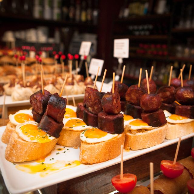 Barcelona: Food & Drink Tasting Tour in Traditional Taverns - The Guided Experience and Local Insights