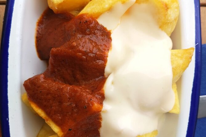 Barcelona Food Tour: Tapas, Drinks and Delights with a Local - Vermouth and Patatas Bravas at Muralla Romana