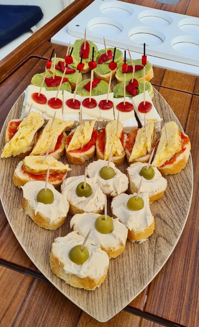 Barcelona: Sailing Tour with Spanish Tapas and Drinks - Departing from Port Olímpic and the Check-In Process