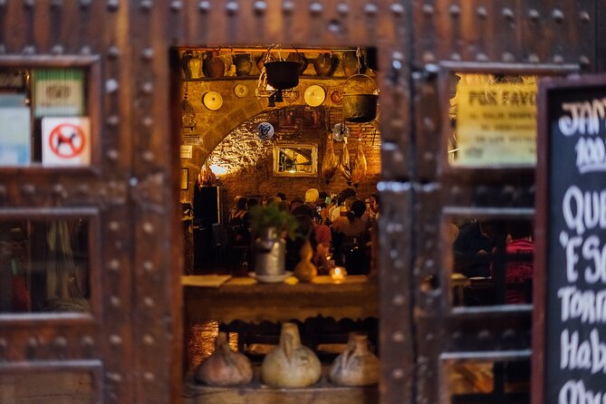 Barcelona Tapas and Wine Private Walking Tour - Visiting Plaça de Sant Jaume and El Fossar de les Moreres