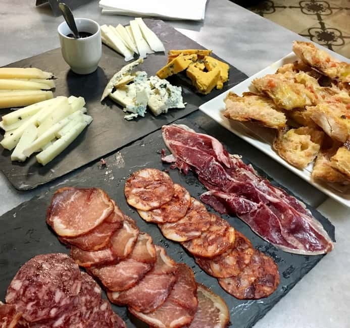 Barcelona: Tapas Crawl full meal & drinks all included - Starting Point Near El Molino Theater in Barcelona