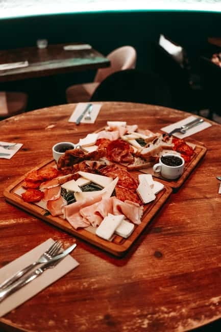 Barcelona: Tipsy Tapas & History Tour in the Gothic Quarter - Vibrant Historic Bar with Color and Soul