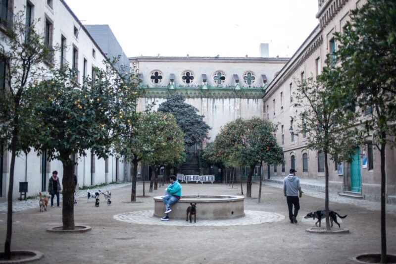 Barcelona's Dark History Walking Tour in El Raval - Final Stop at Jardins de les Tres Xemeneies