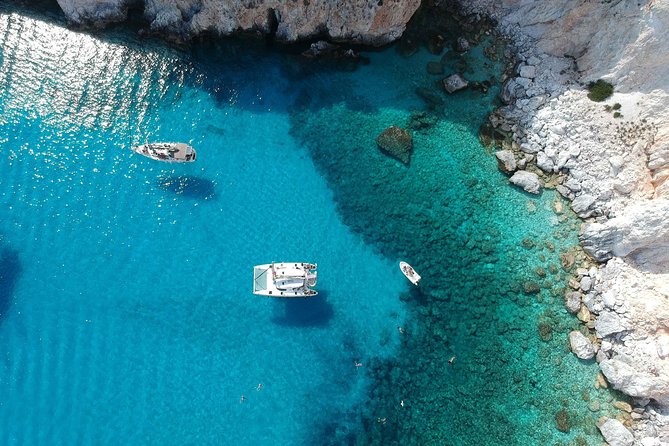 Best of Milos and Poliegos Catamaran snorkelling Cruise with BBQ - Sunbathing and Swimming at Gerakas Beach