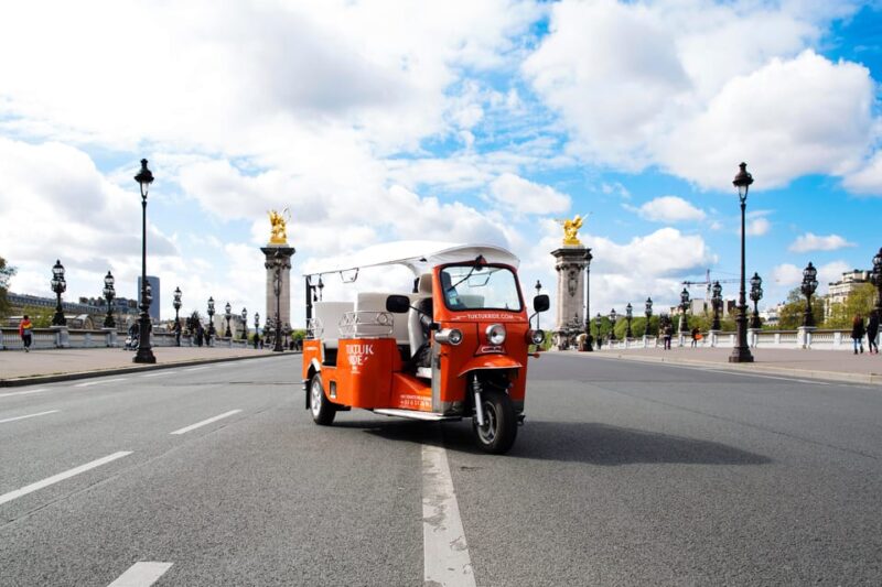 Best of Paris in 2 Hours by Private Electric TukTuk - Iconic Landmarks with Photo Stops and Guided Commentary