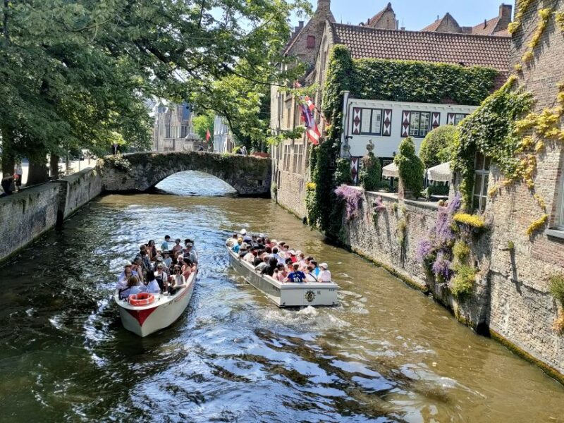 Bruges: Small Group Boat Cruise and Guided Walking Tour - Landmark Highlights: From the Church of Our Lady to the Four Horsemen