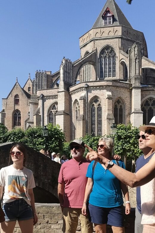 Bruges: Small Group Boat Cruise and Guided Walking Tour - Visiting the Huidenvettersplein and the Beguinage